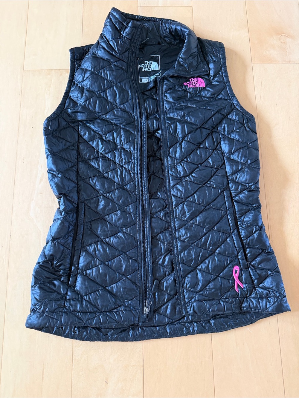 The North Face Black Quilted Packable Vest with breast cancer ribbon, size xs